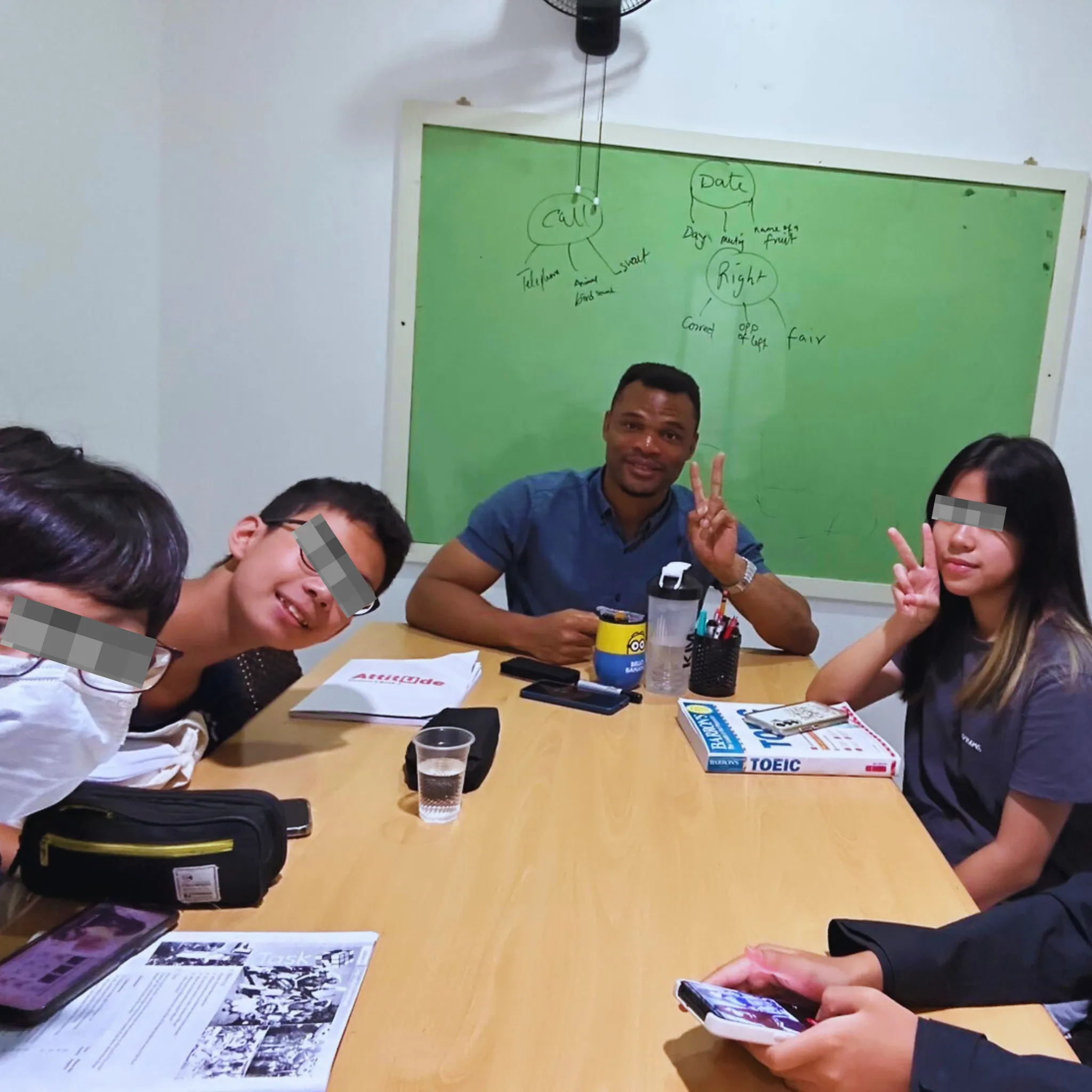 Godswill teaching students in a classroom setting